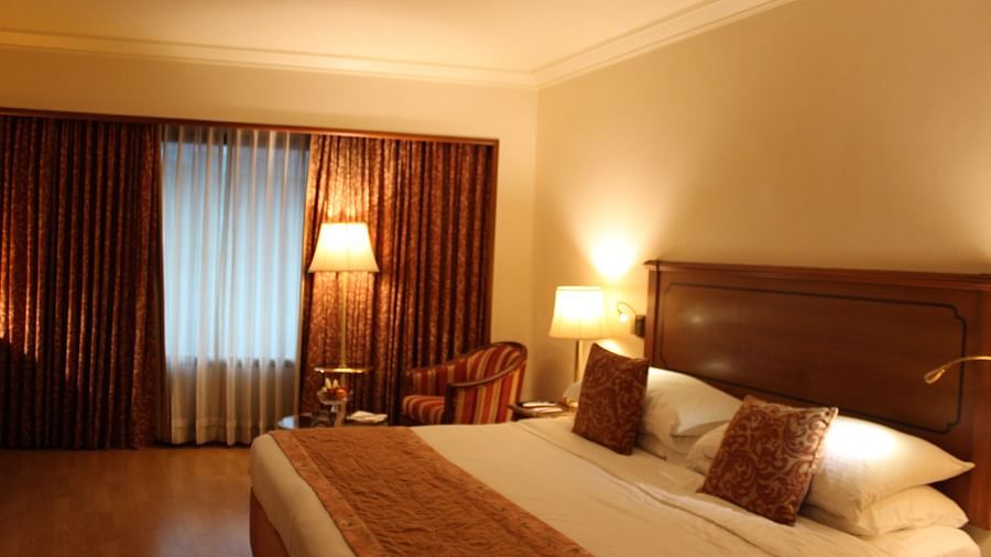 room with king size bed and warm lighting