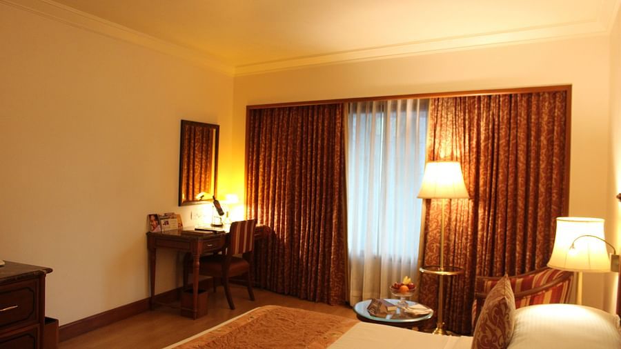 room with king size bed and warm lighting