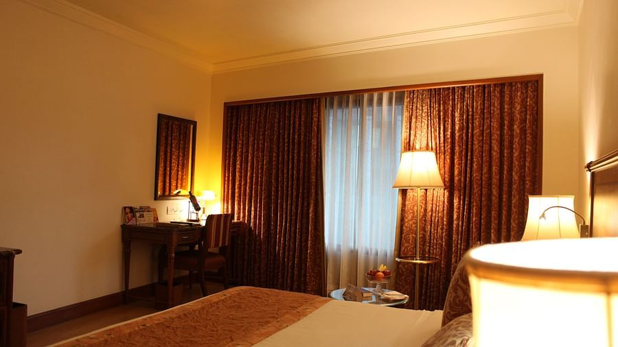 room with king size bed and warm lighting