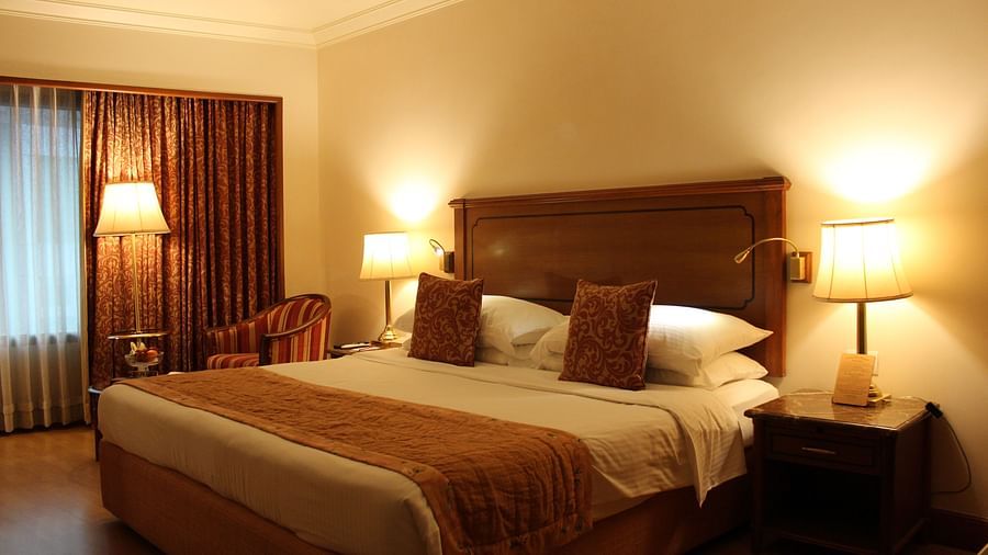 room with king size bed and warm lighting