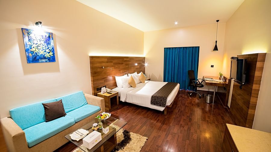 a full view of a room with bed and sofa  - The Orchid Hotel Pune
