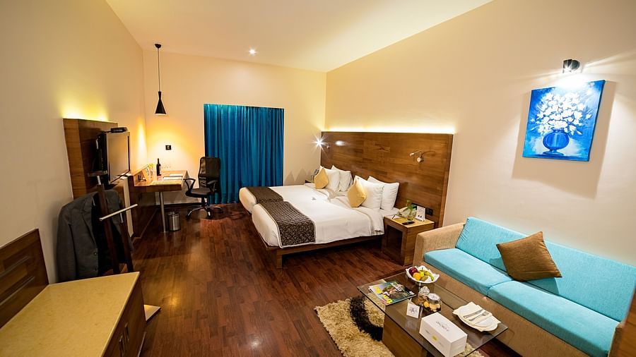 a full view of a room with bed and sofa 3 - The Orchid Hotel Pune