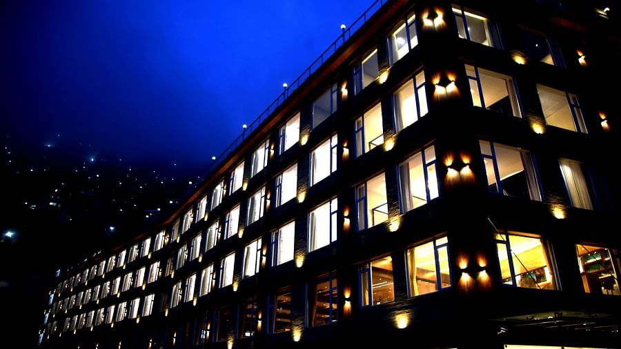 Facade with every window lit up at night - The Orchid Hotel Shimla