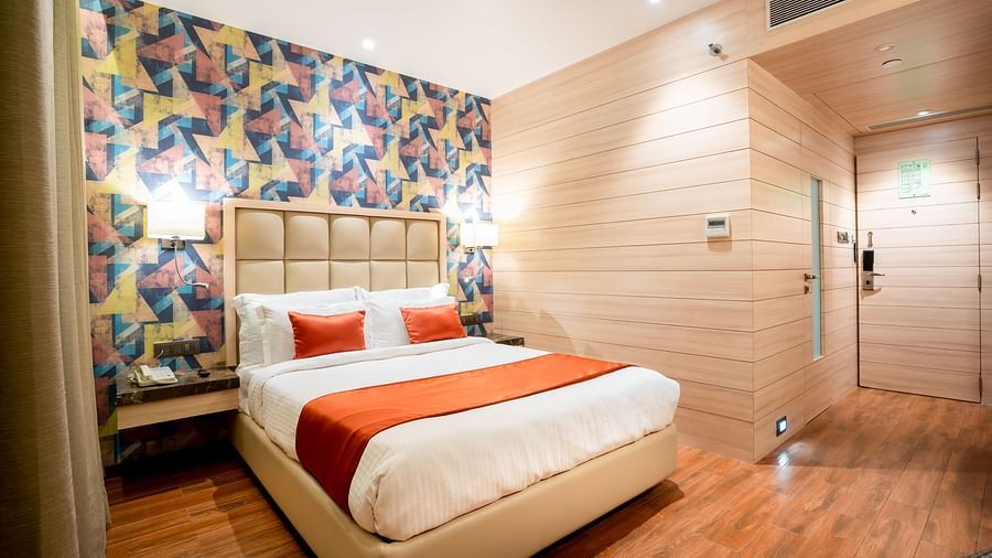 bedroom of one of the Deluxe rooms at The Orchid Lonavala 124