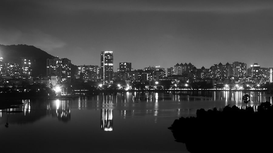 A night shot in greyscale of the buildings in Powai, Mumbai with the lights on