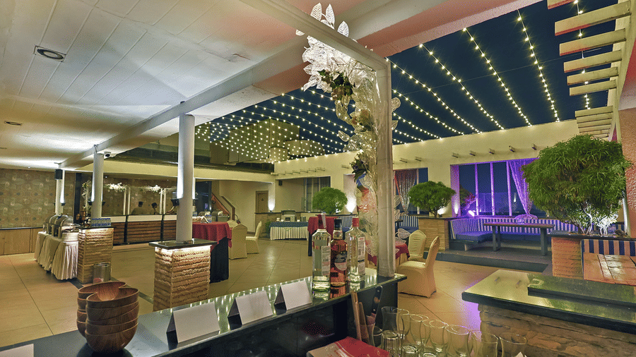 Open air dining area with ambient lighting and stylish seating at The Sonnet, Jamshedpur.