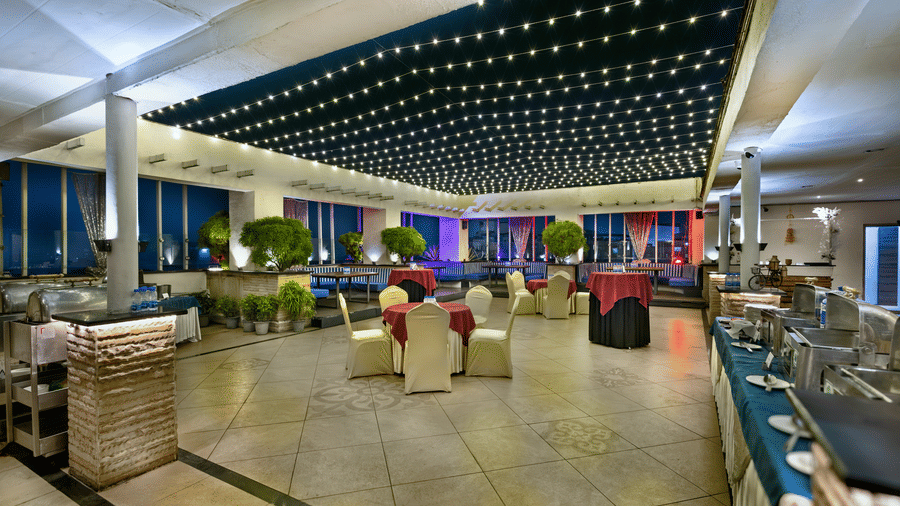 Vibrant restaurant space with contemporary decor and evening ambience at The Sonnet, Jamshedpur.