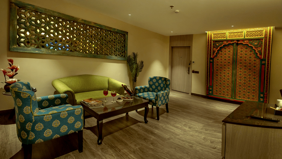 Well appointed suite featuring cozy seating and refined interiors at The Sonnet, Jamshedpur.