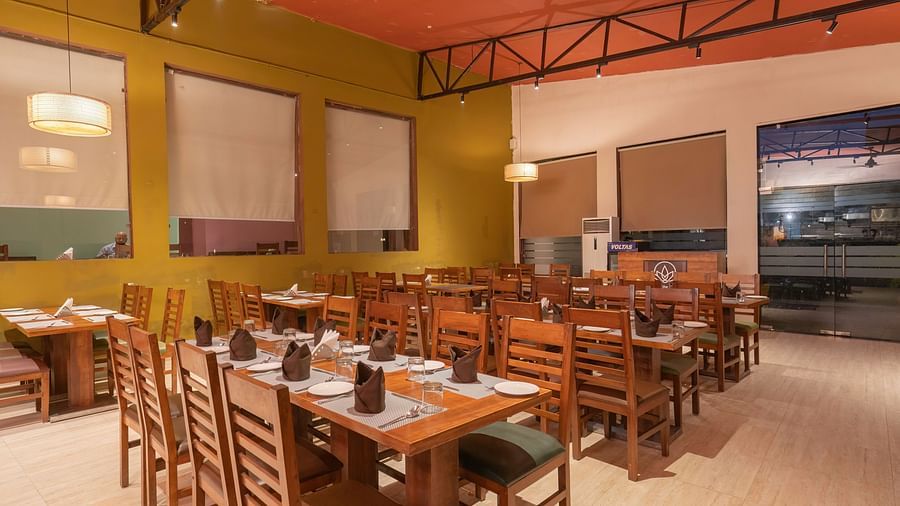 Elegant dining setup at The Tattwaa Corbett Spa & Resort.