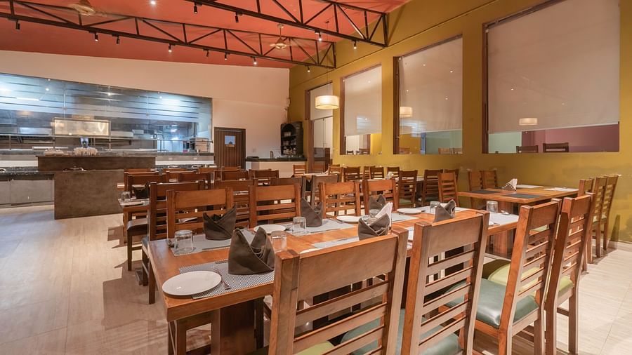Restaurant seating with warm lighting at The Tattwaa Corbett Spa & Resort.