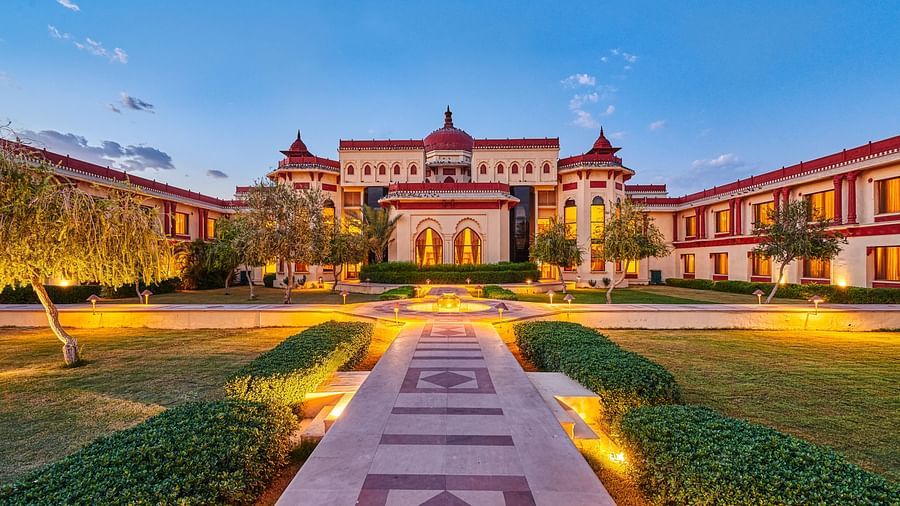 evening view of a courtyard decorated with soft yellow lights - The Ummed Jodhpur, Palace Resort and Spa