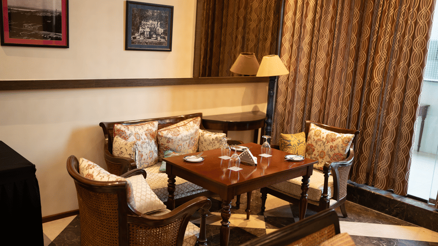 Warm lounge seating area with cushioned chairs at Zaal Lounge & Kitchen, The Waverly Hotel & Residences