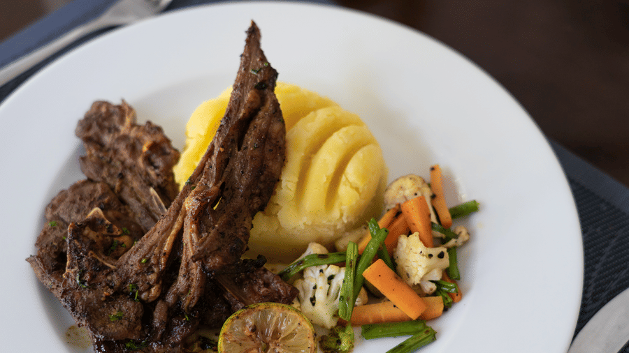 Grilled lamb served with mashed potatoes and vegetables at the restaurant at The Zehneria, Nairobi