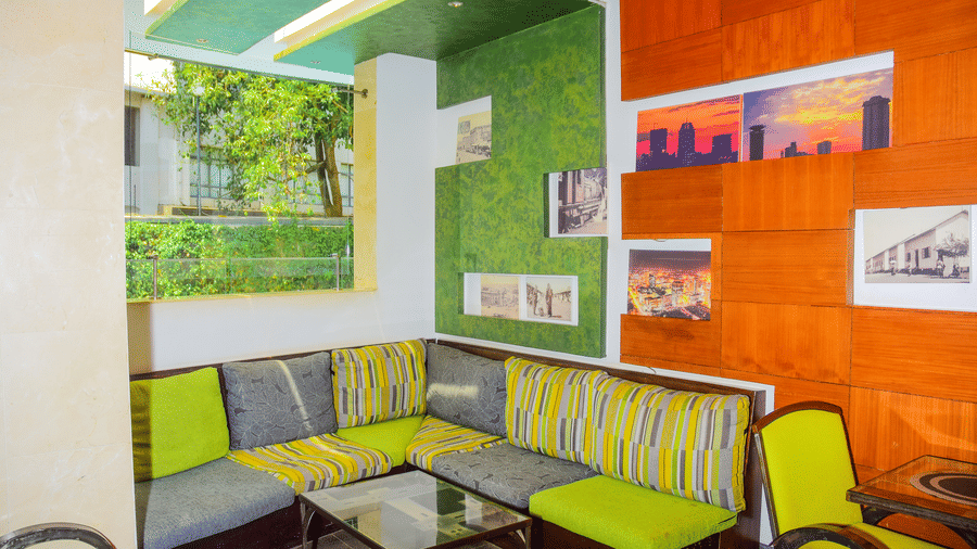 The vibrant lounge seating area at NBO Lounge featuring colourful walls at The Zehneria, Nairobi.