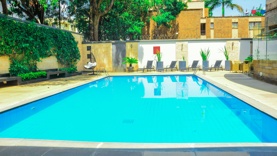 Wide view of the outdoor swimming pool area at The Zehneria, Nairobi