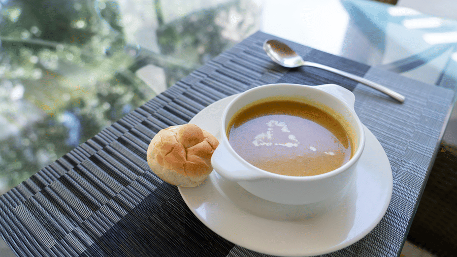 Creamy soup served in a white bowl on a restaurant table at The Zehneria, Nairobi