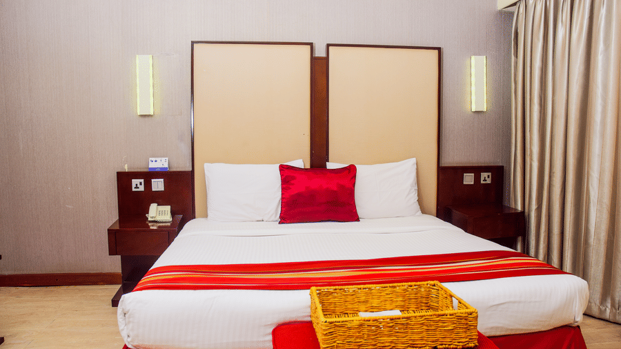 The Superior Room at The Zehneria, Nairobi featuring a double bed and warm lighting.