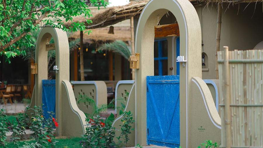 a side view of the Royal Villas gate at Themis Mudhouse - A Nature's Retreat Resort & Wellness