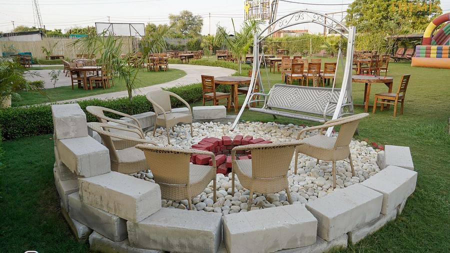 Charming seating area featuring a table and chairs, offering a beautiful view that enhances the relaxing atmosphere.