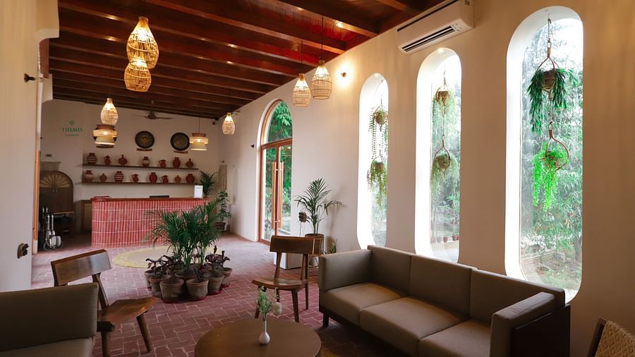 reception area with seating arrangements at Themis Mudhouse - A Nature's Retreat Resort & Wellness