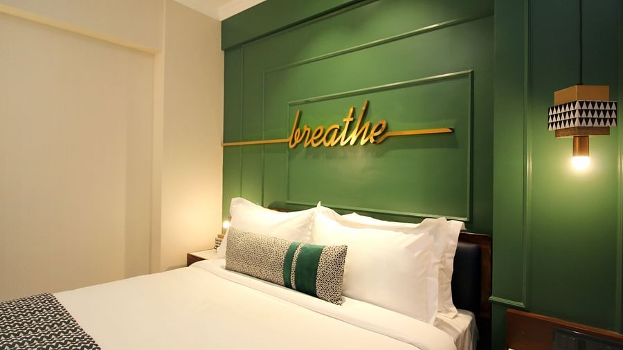 rooms with a king bed and modern interiors at theory9 service apartments bandra