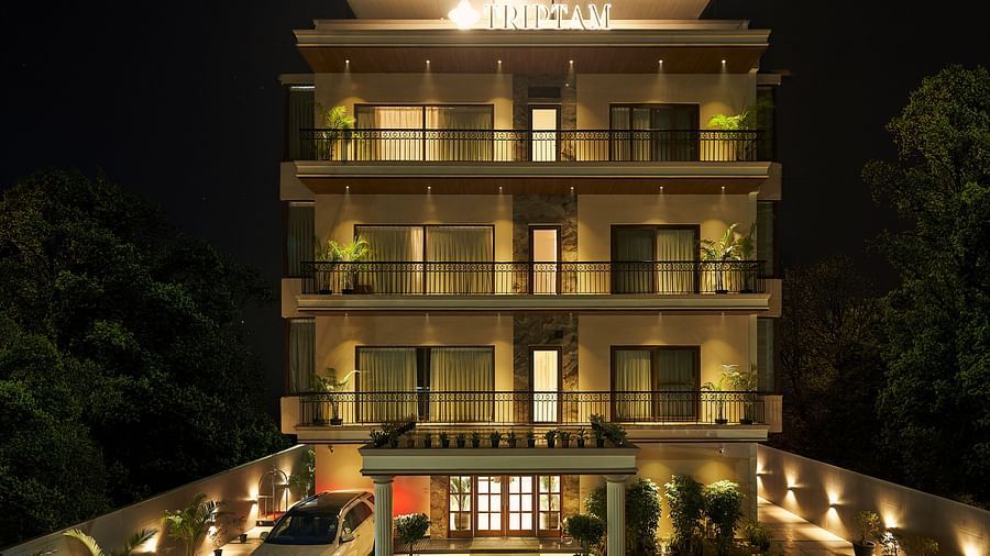 exterior facade of Triptam Hotel, Vrindavan lit up at night