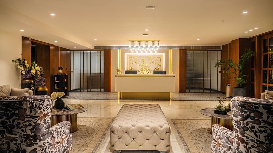 Entrance of a hotel showcasing a vibrant lobby with sofas and seating arrangements
