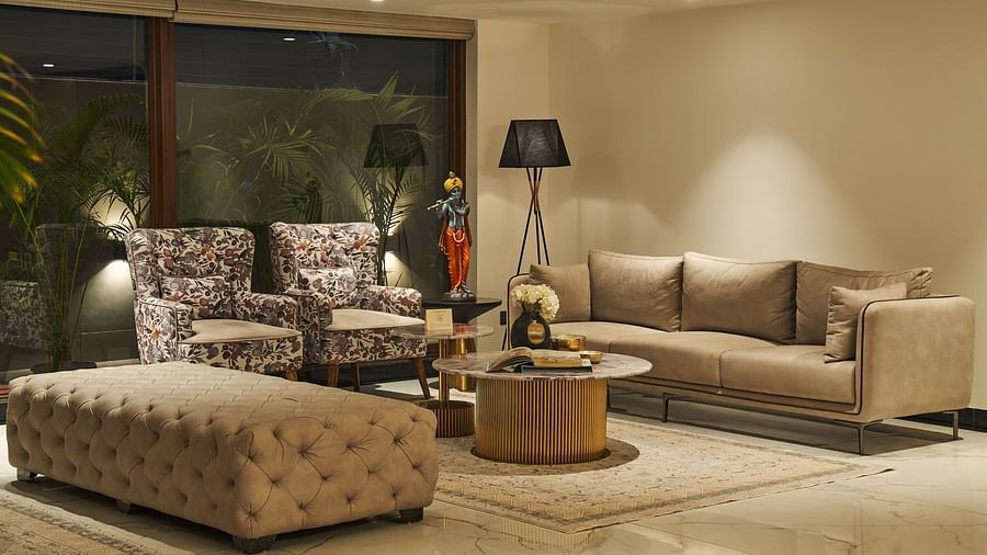 Seating area in the lobby featuring Sofas, tall lamps, etc at Triptam Hotel, Vrindavan