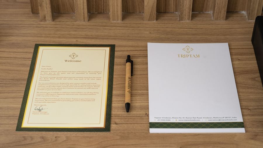a pen and notepad in the presidential suite at Triptam Hotel, Vrindavan