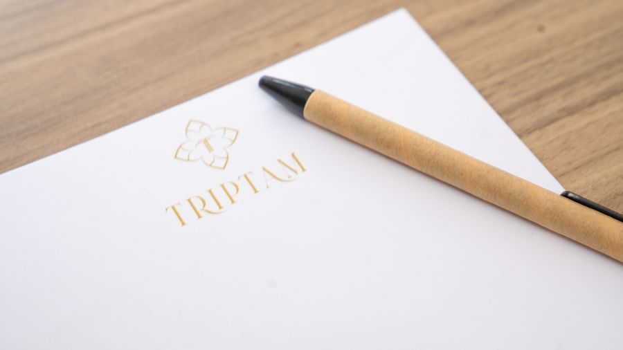 a pen and notepad in the presidential suite at Triptam Hotel, Vrindavan