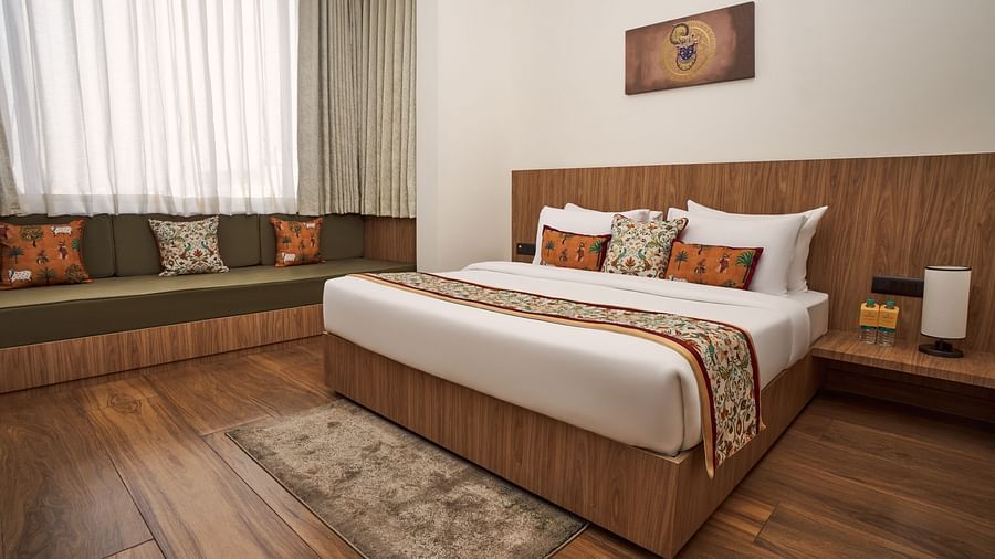 double bed in one of the rooms at Triptam Hotel, Vrindavan