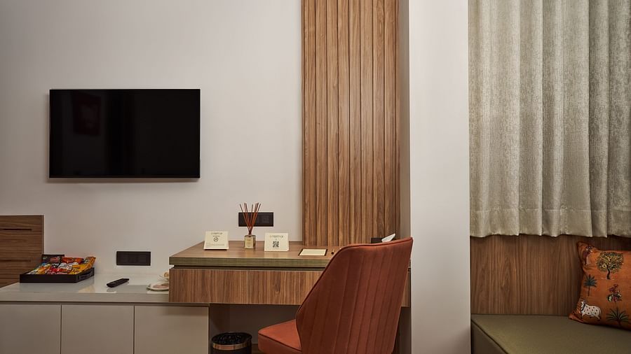television and work desk in one of the rooms at Triptam Hotel, Vrindavan