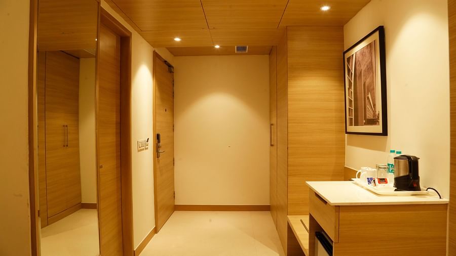 An image of the executive suite with a minibar and an electric kettle to the right and a large mirror to the left - Tulip Inn, Zirakpur