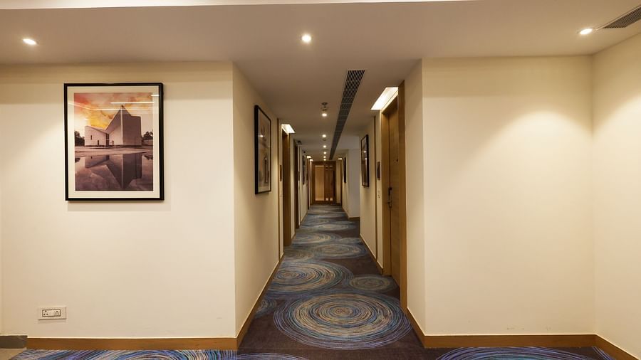 An image of a carpeted corridor leading to our hotel rooms - Tulip Inn, Zirakpur