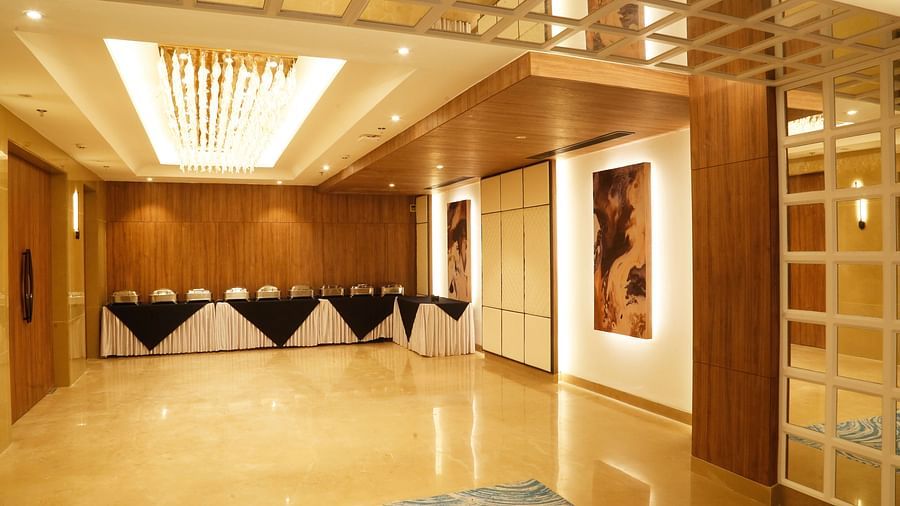A buffet area with chandeliers and sophisticated decor - Tulip Inn, Zirakpur
