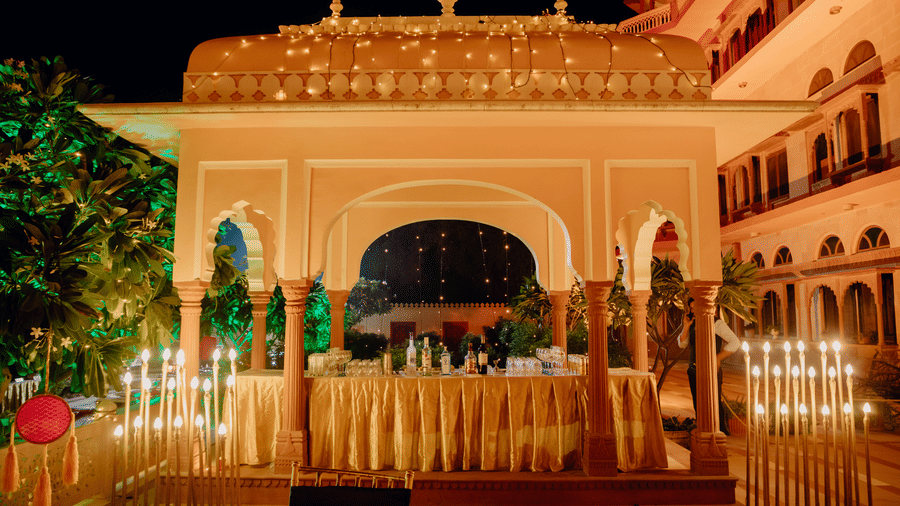 Beautifully lit palace entrance with elegant decor for a grand wedding celebration.