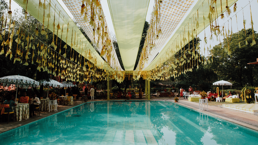 Poolside wedding setup with floral hangings and elegant decor at Umaid Palace -Luxury Destination Wedding Resort in Jaipur