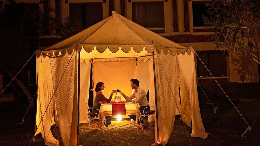 Ummed Hotels - Guests enjoying a romantic candle light dinner in a tent