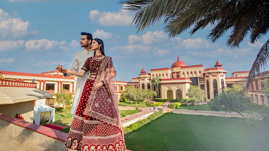 Ummed Hotels - The bride and groom and our hotel in the backdrop