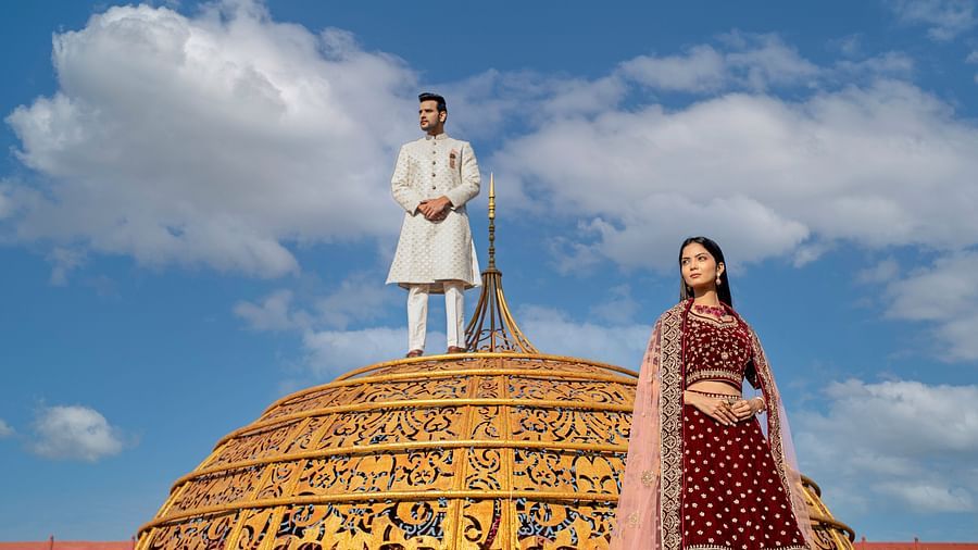 Ummed Hotels - The groom on the dome and the bride standing close to the dome