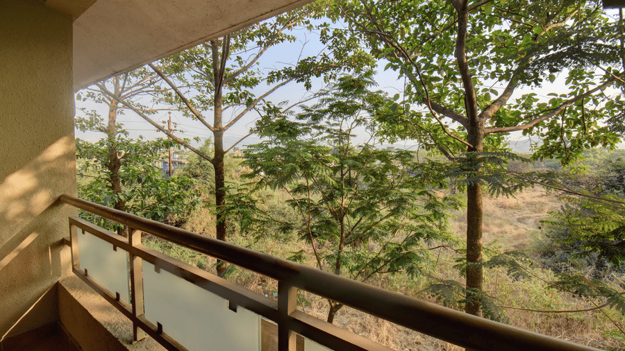 Balcony view with lush greenery and serene surroundings at VITS Lonavala.