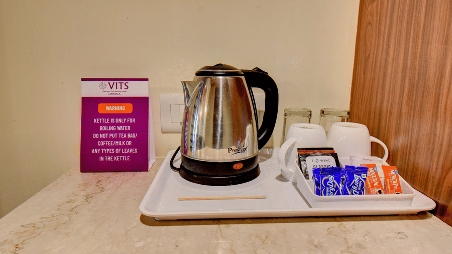 In-room tea and coffee maker with complimentary amenities at VITS Lonavala.
