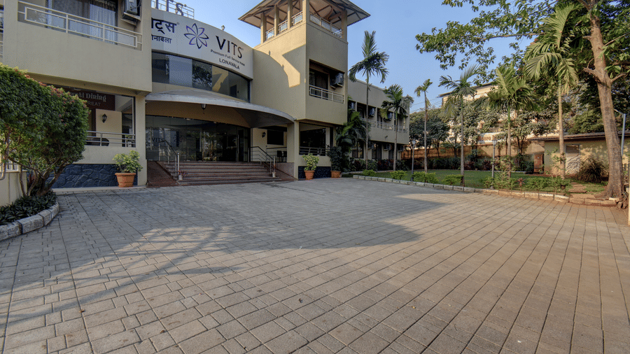 Wide driveway and main entrance façade at VITS Lonavala.