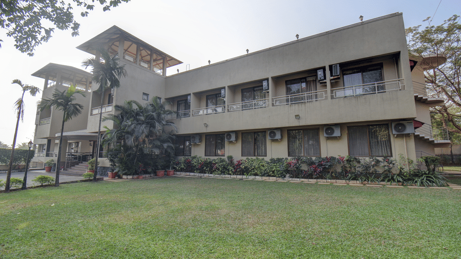 Resort building with garden lawn and spacious surroundings at VITS Lonavala.
