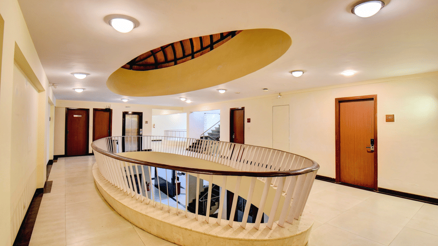 Interior corridor with modern lighting and balcony-style railing at VITS Lonavala.