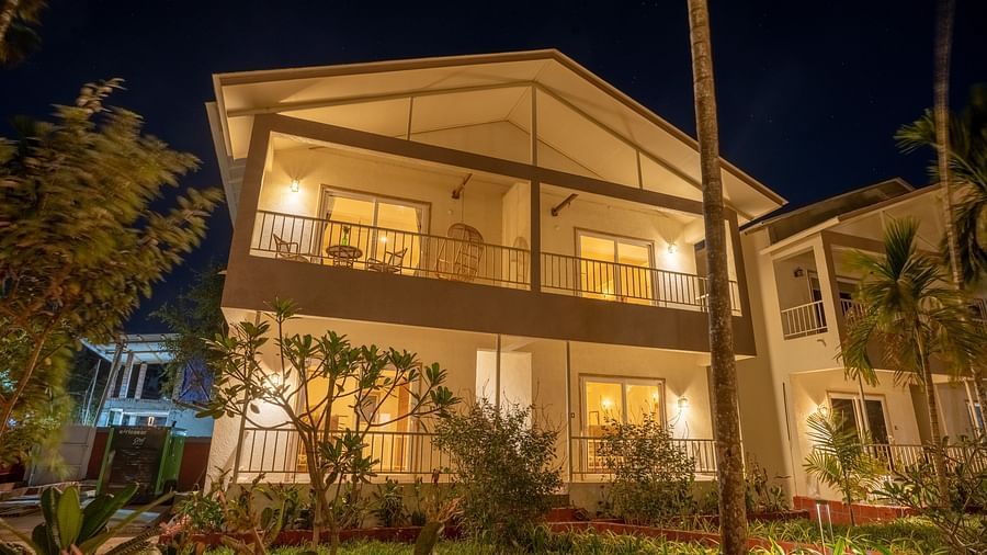 Facade image of VITS Select Casuarina Diveagar with lights on during the night