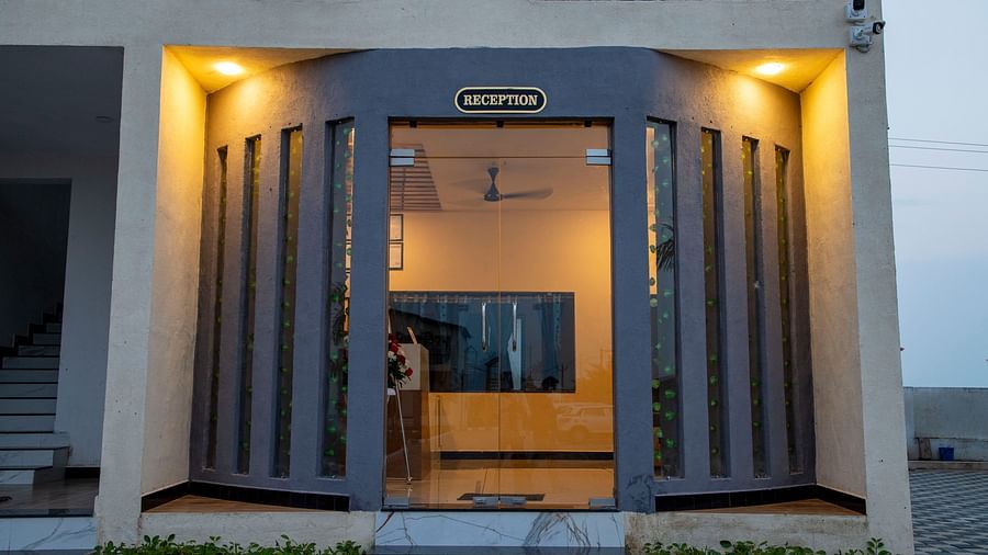 The exterior of a building with an illuminated entrance, showcasing modern architectural design and warm lighting - VITS Select Diamond Resort, Sasan Gir