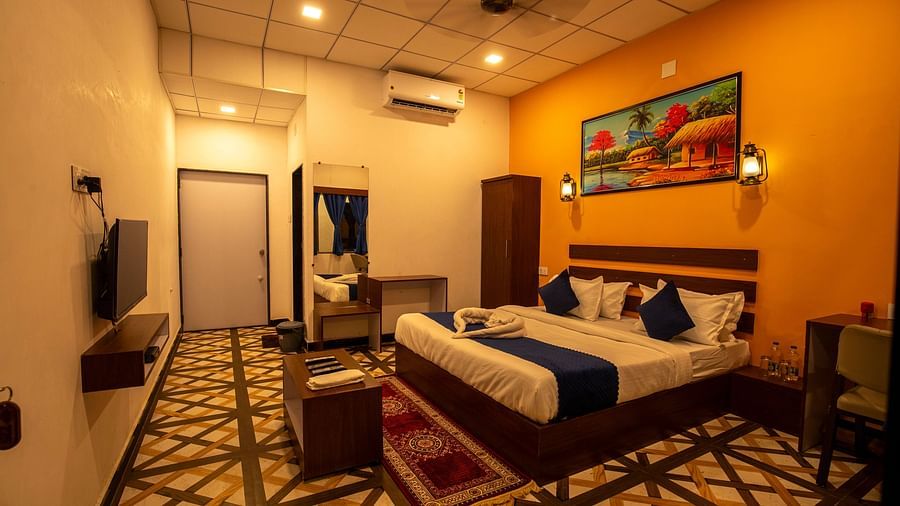 full view image of the super deluxe room with beautiful tiled flooring a double bed - VITS Select Diamond Resort, Sasan Gir