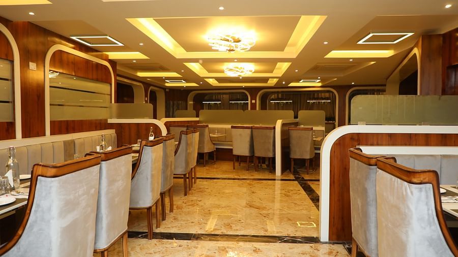 Elegant dining area with modern lighting and comfortable seating arrangements at VITS Select Grand Inn, Ratnagiri
