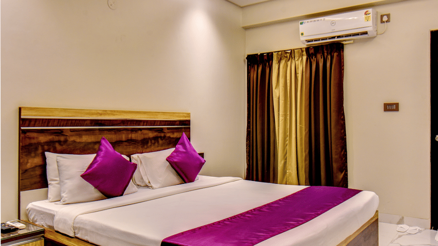 VITS Select Kharadi Pune reservation card on Super Deluxe Room bed with purple linen